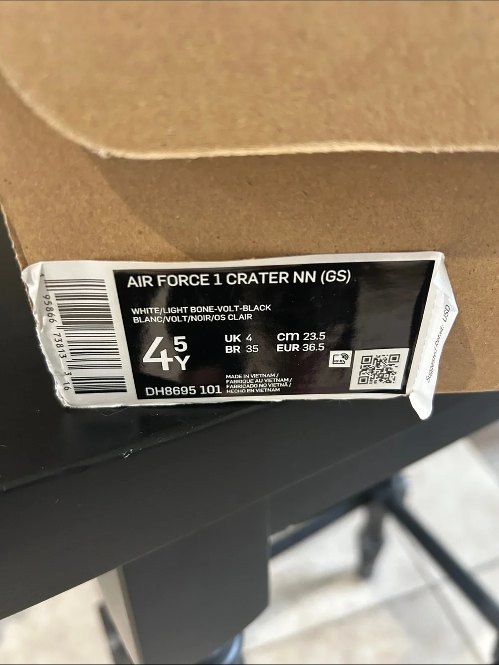 Nike Kids White Sneakers with Black Collar and Cream Swoosh 4.5